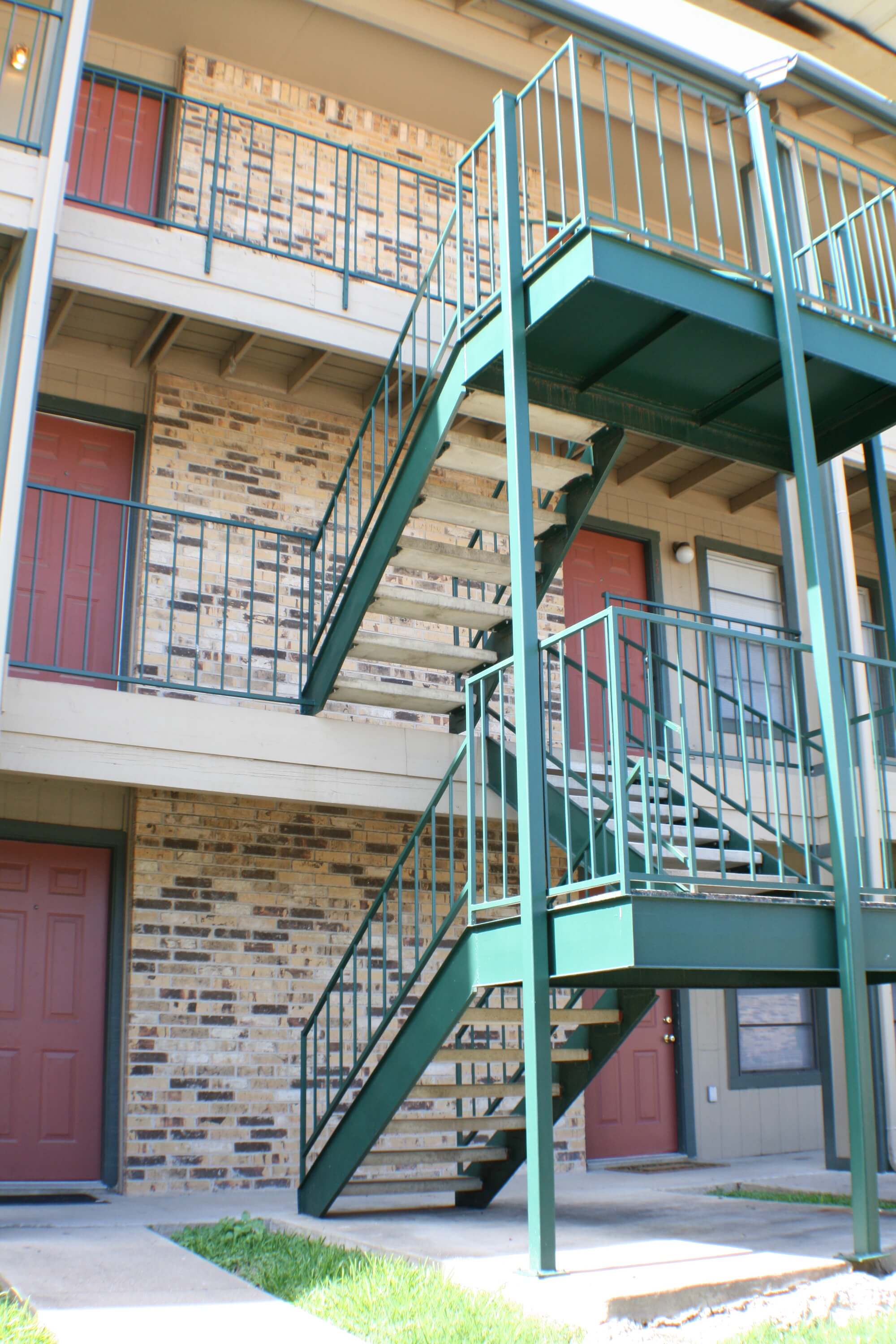 The staircases and front doors of apartment units at Stadium View.