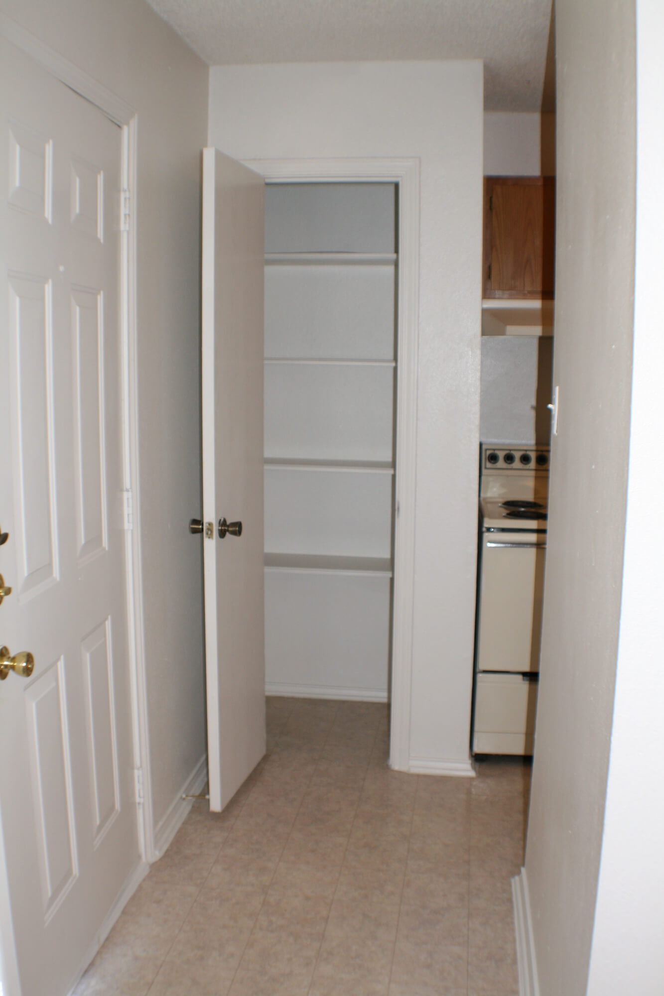 A built-in pantry available in the kitchen of units at Stadium View Apartments.